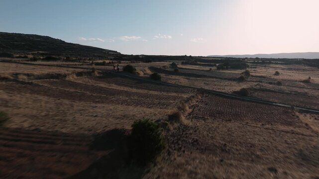 Drone view of ancient agricultural terraces overlooking Lake Titicaca on Isla del Sol, one of Bolivia&rsquo;s most iconic cultural landscapes.