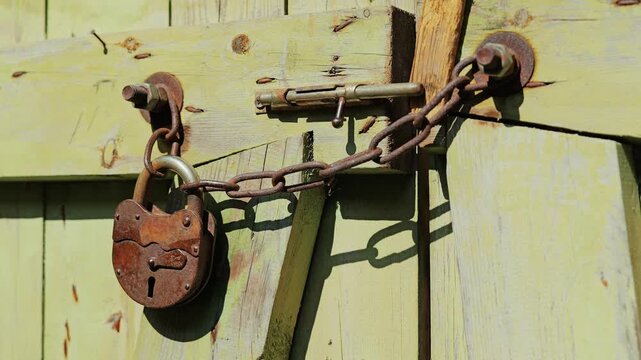 Corroded security hardware reflects decades of exposure and forgotten use