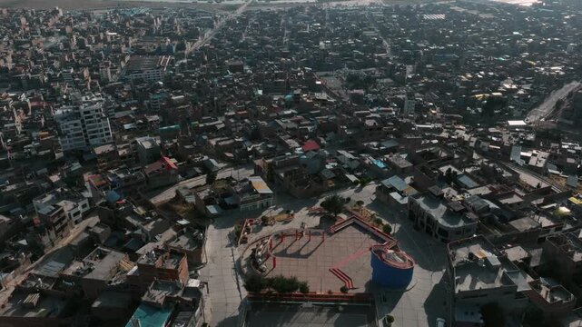 Aerial view of Puno and the waters of Lake Titicaca, showcasing one of Peru&rsquo;s most iconic high-altitude urban landscapes.