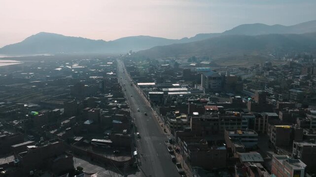 Aerial view of Puno and the waters of Lake Titicaca, showcasing one of Peru&rsquo;s most iconic high-altitude urban landscapes.