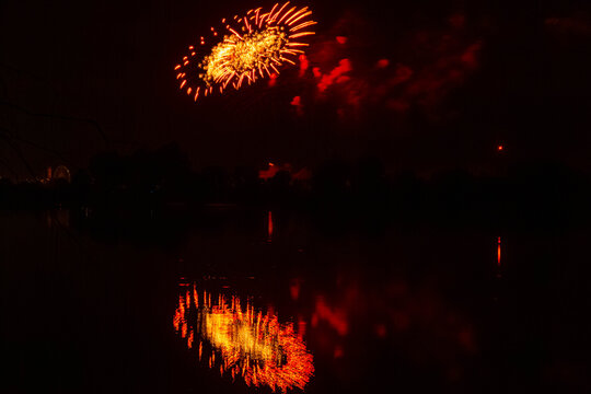 Colorful bavarian fireworks during the 2025 Gaeuboden Volksfest with reflections in river Danube at Straubing, Bogen, Bavaria, Germany