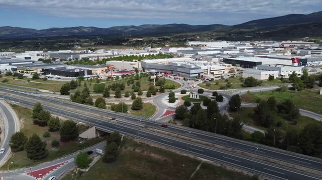 Orbiting around the entrance to the Alfa&ccedil; industrial area located in Ibi, Spain, and the A-7 motorway.