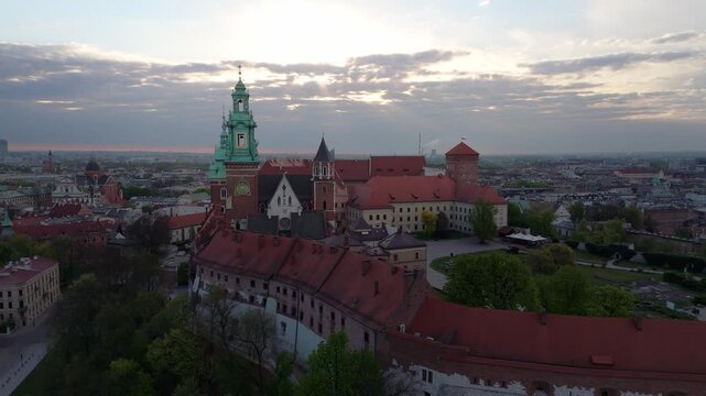  An aerial flyover of Wawel Castle in Krakow at dawn in spring in Poland.
