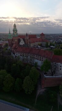  An aerial flyover of Wawel Castle in Krakow at dawn in spring in Poland.