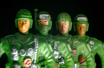 Obraz premium Toy special forces soldiers in uniform on a black background