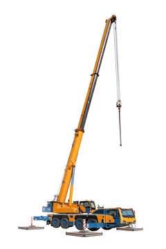 Vertical view, isolated full-size image of a truck crane with its boom extended and hook hanging down, and with the stops on the sides of the machine extended, on a white background