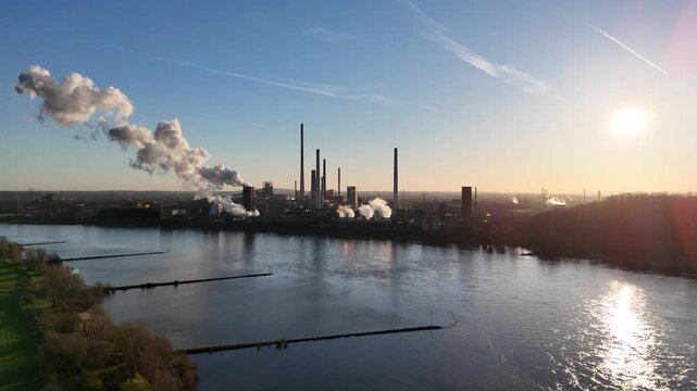 Massive smoke release from coking tower at dawn