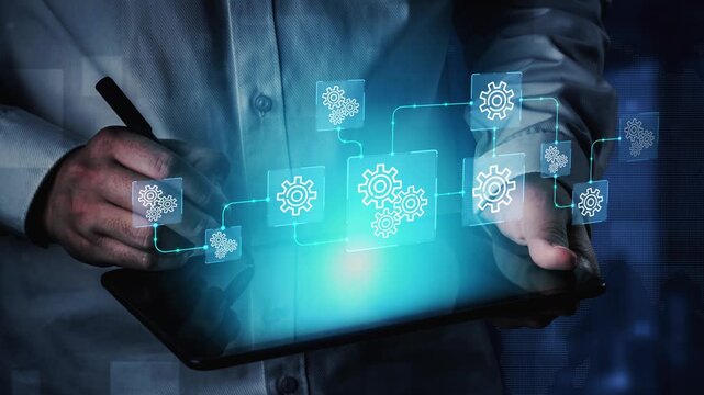 Digital Transformation and Automation Concept with Man Holding Tablet and Illustrative Gears Representing Workflow and Process Optimization. Entropy.