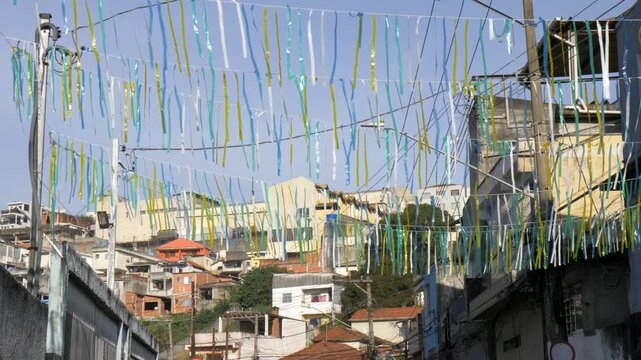 Green and yellow flags in a Brazilian neighborhood celebrating the 2026 World Cup.