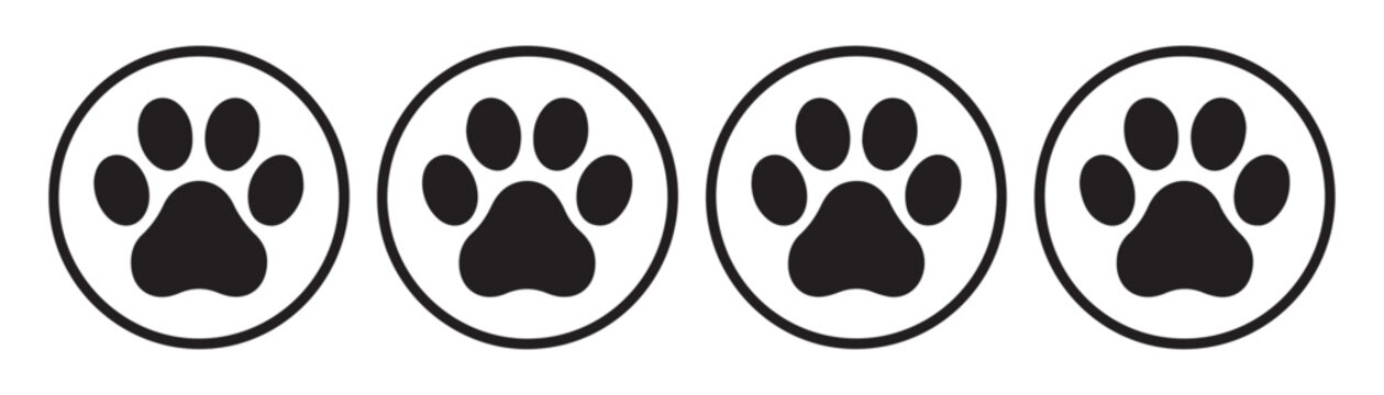 Four circular framed icons featuring different styles of black animal paw prints for web design set.