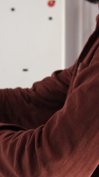 Man Folding his Shirt Sleeve