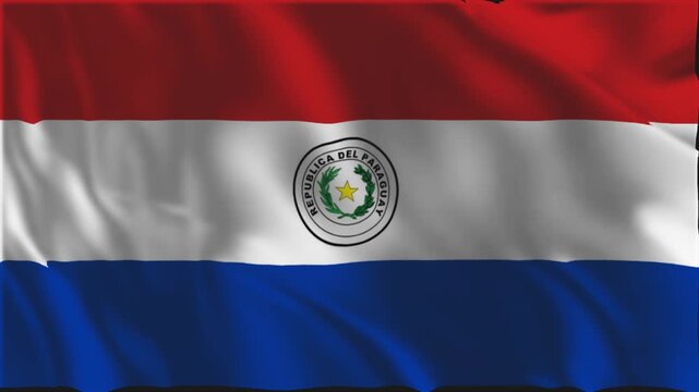 The Paraguayan flag waving slowly in the foreground