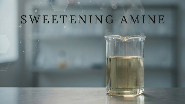 Glass beaker with yellow liquid and steam on table in laboratory setting with sweetening amine text