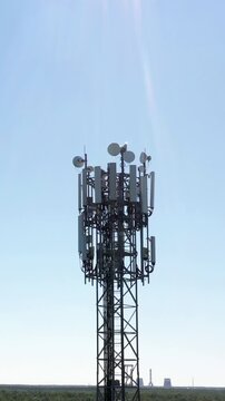 Cellular GSM tower. Communication antenna. Future technology. Vertical footage
