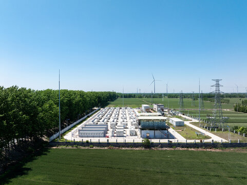 Panoramic view of wind power station energy storage facility under clear blue sky