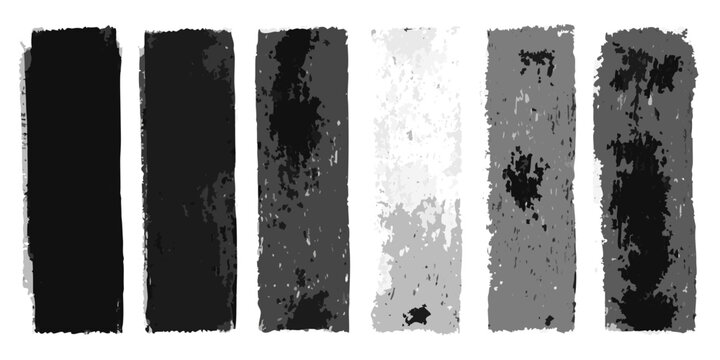Charcoal rubbing blocks with varying shades on a white background