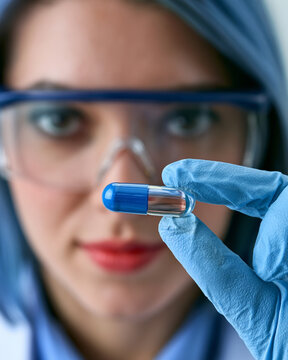 Female Scientist in Lab Conducts Pharmaceutical Research in Microscope Analysis for Medicine Innovation and Clinical Trials