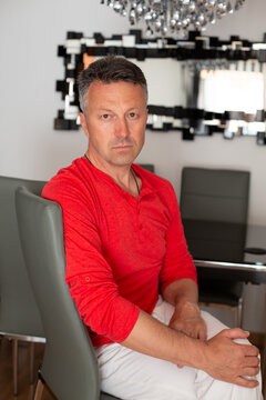 Portrait of a man wearing the traditional white-and-red attire of the San Ferm&iacute;n festival in Pamplona. A contemporary lifestyle image celebrating Spanish culture and heritage