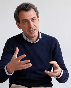 Caucasian businessman discussing corporate equality and diversity in office interview, middle aged corporate worker