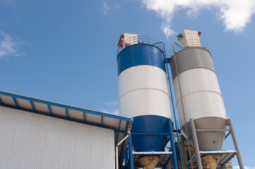 Obraz premium Two factory silos.