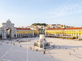 Obraz premium Lisbon City at Sunset. Commerce Plaza, Equestrian Statue, Tourists and Rua Augusta Arch. Portugal. Aerial Drone Shot