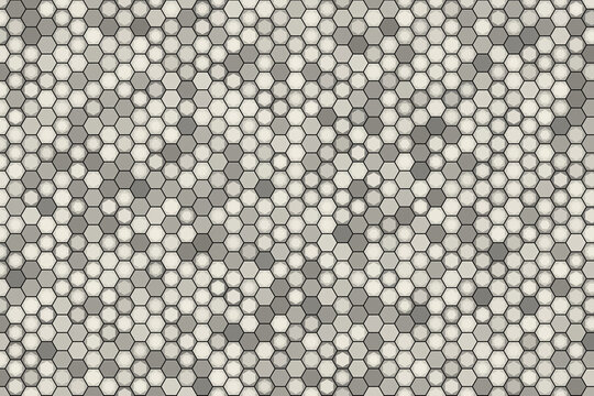 Geometric background pattern of small tessellating hexagons in various shades of gray and white