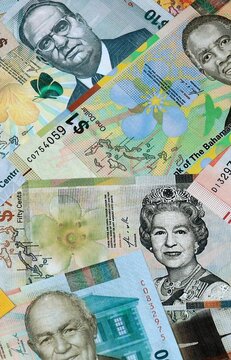 Bahamian dollar money banknotes bunch on table. Bahamas bills of BSD currency close up