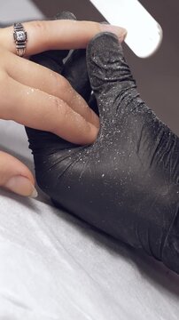 Manicure process. Correction of female nails with nailfile. Vertical footage
