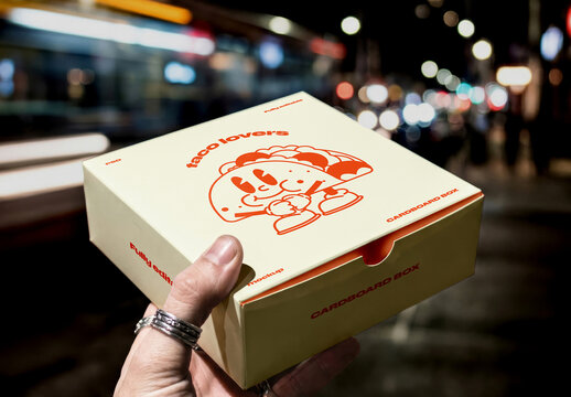 Hand Holding Food Delivery Box Mockup