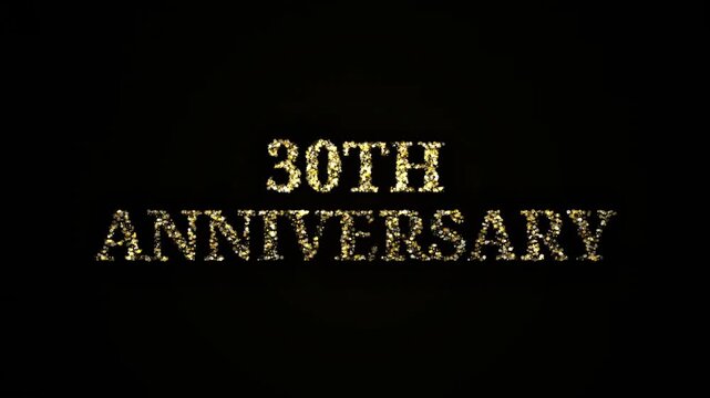 Sparkling 30th Anniversary gold glitter particles forming text on black background