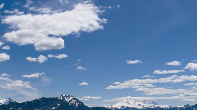 Time Lapse: Majestic Clouds Drift Over Snow-Capped Mountains in Fraser Valley, British Columbia