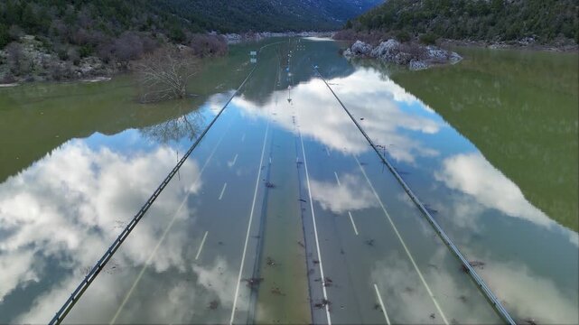 Aerial drone footage of the flooded Eynif Plain near Demirkapı Tunnel on the new Antalya Konya highway in Turkey