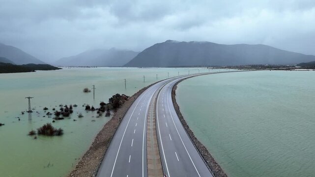 Submerged mountain valley landscape of Eynif Plain under heavy seasonal flood waters