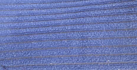 Navy blue fleece fabric texture with horizontal ribbed stitch lines © sunkit