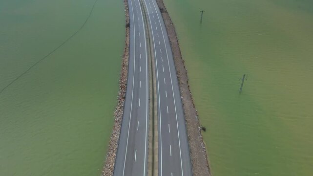 Submerged mountain valley landscape of Eynif Plain under heavy seasonal flood waters