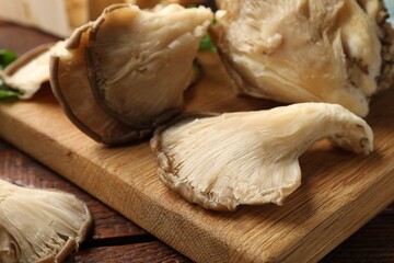 Fototapeta premium Fresh oyster mushrooms on wooden table, closeup