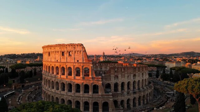 The colosseum in rome at sunset with a cityscape in the background and a blue and orange sky