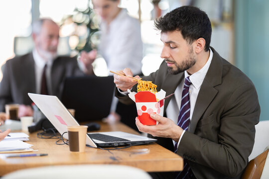 Office staff are indignant because of unpleasant smell of food and resent for eating male colleague. Food exudes peculiar smell, repulsive smell of food filled office