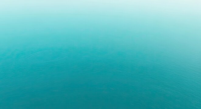 Calm ocean water with gentle ripples on the surface in a serene environment