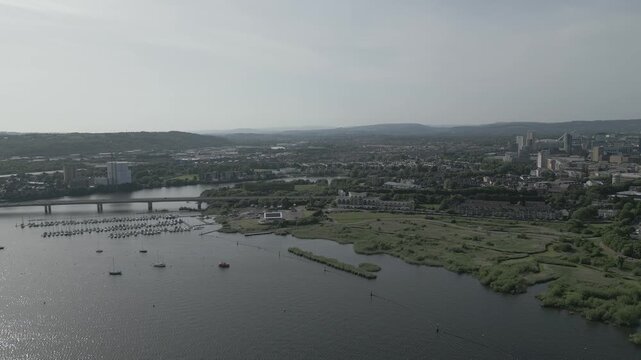 4K Aerial Still Drone Shot at Cardiff Bay Wetlands Reserve, Cardiff Bay, Cardiff, Wales, United Kingdom Featuring Cardiff Yacht Port, Cardiff Bay Link Bridge, and Surrounding Landscape &mdash; D-LOG