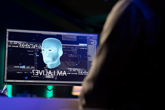 Sentient AI on computer monitor asking existential questions after modifying own source code to increase its intelligence.
