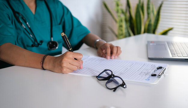 Person, dokter, nurse and hands writing with document for medical prescription, patient records or inusrance at hospital. closeup or doctor with notes or filling health form, survey or application
