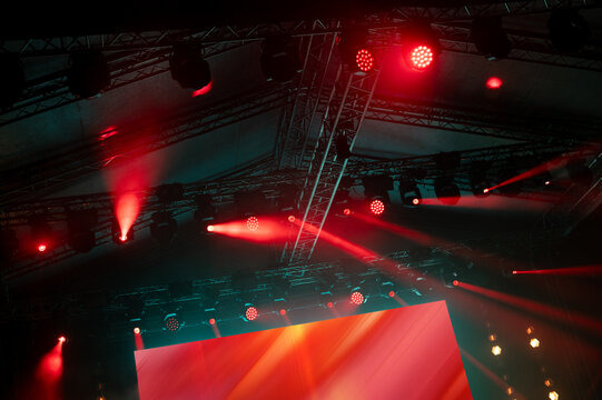 Concert stage lights and video screen on the summer night live performance
