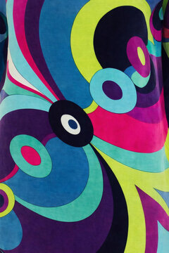 Retro 60s psychedelic seamless pattern with vibrant swirling geometric shapes in pucci style