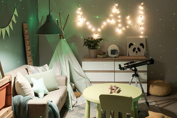 Cozy children's playroom with star projector, telescope, teepee, and sofa for imaginative learning and relaxation © Pixel-Shot