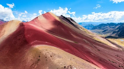 Fotobehang Bordeaux Colorful Mountain Peaks Rise Under a Bright Sky in the Andes of Peru During Daytime  © Rodrigo