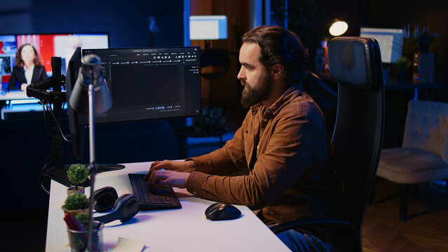 Computer engineer deliberating ways of fixing errors while developing code on PC. IT professional brainstorming ways of solving database errors, remotely working from home.