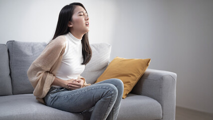 Obraz premium Attractive woman stomach ache menstrual pain Stomach disease, intestinal disease, gastrointestinal disease
