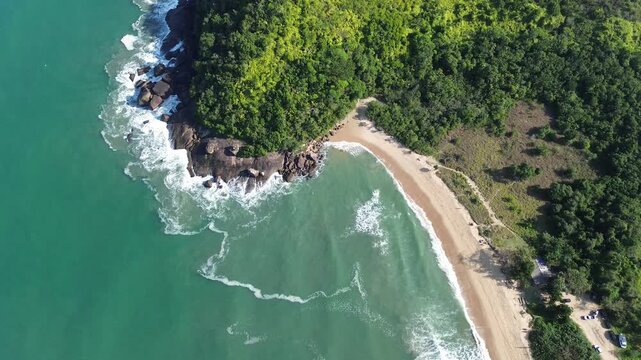 Drone view of a tropical beach with clear waters and forest along the shore. Praia Grande do Bonete (Praia Deserto), Brazil