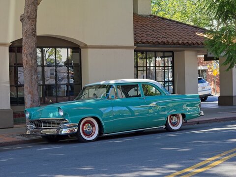 1956 Ford Fairlane parked on downtown street